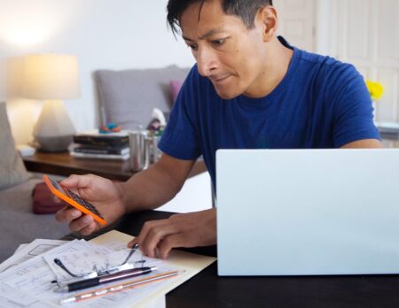 man calculating compensation