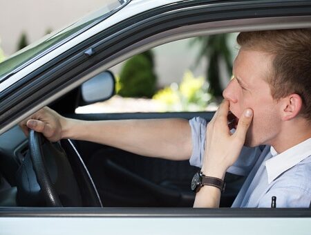 Bored man waiting in traffic jam